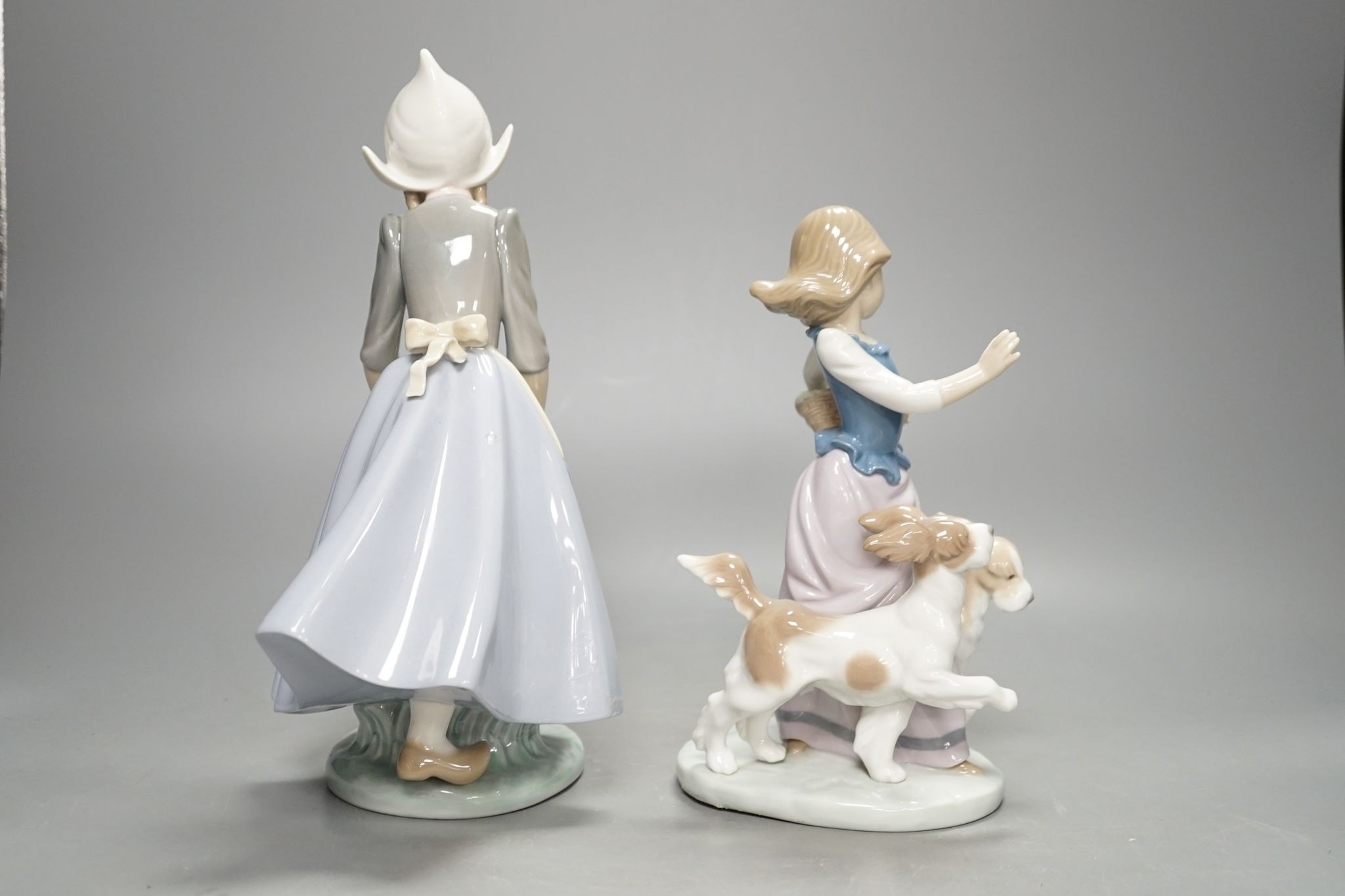 Two Lladro figure groups, tallest 26 cm